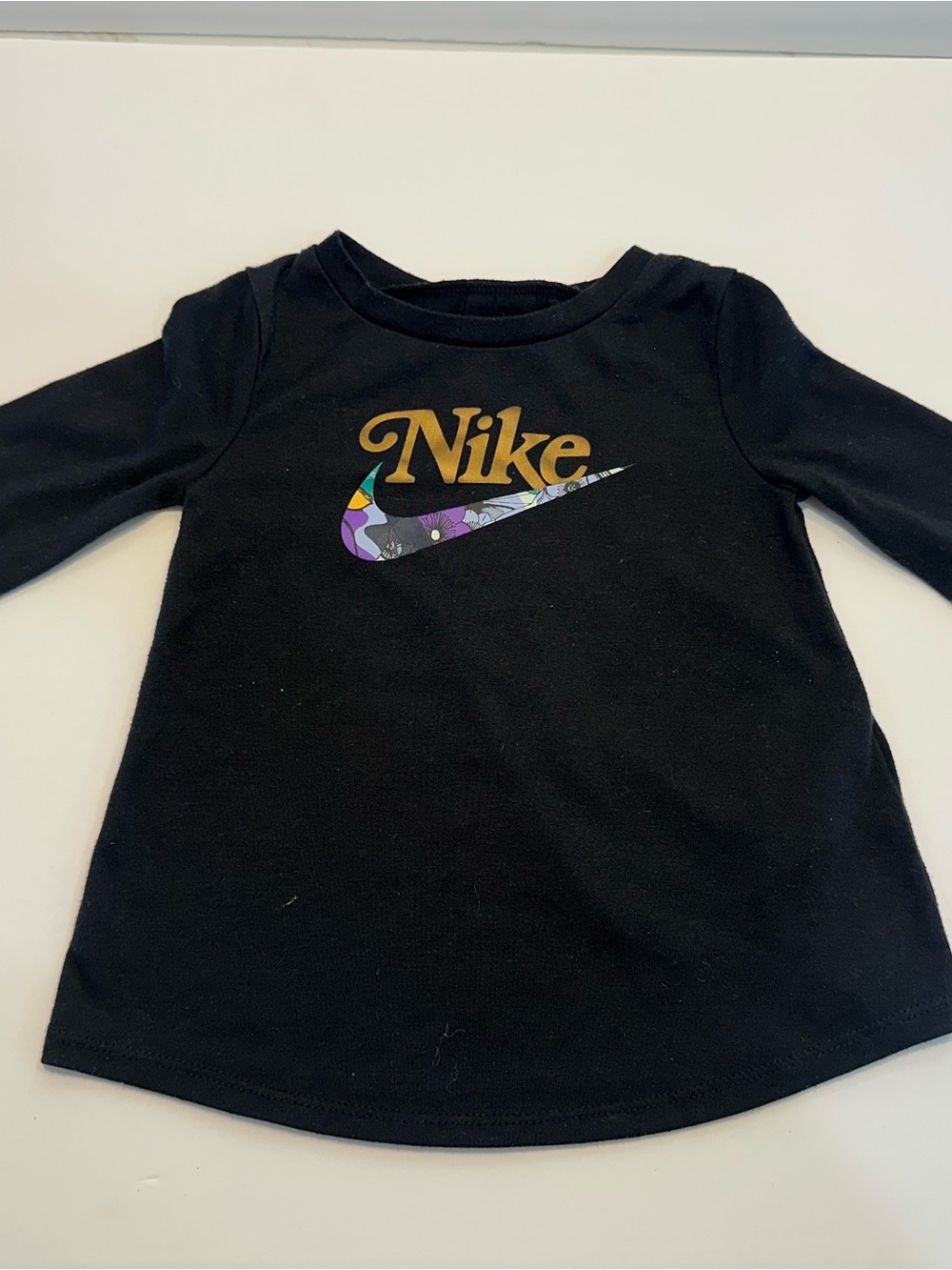 Nike Kid's Black Long Sleeve Tee with Gold Logo and Floral Swoosh